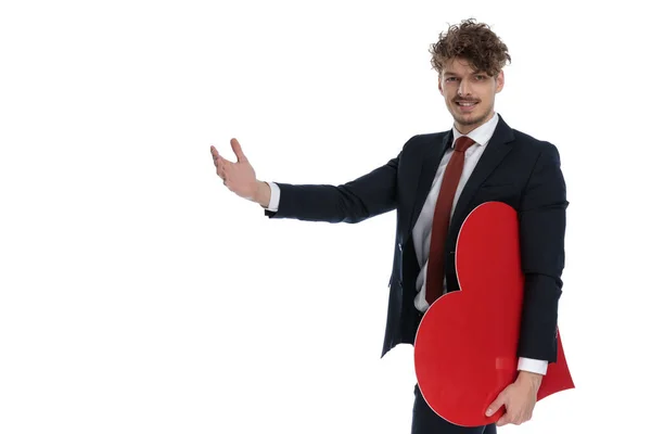 Positive Businessman Holding Heart Shape Presenting While Wearing Suit Standing — Stock Photo, Image