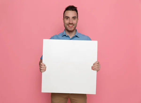 Young Handsome Casual Man Holding Blank Board Smiling Pink Studio — Stock Photo, Image