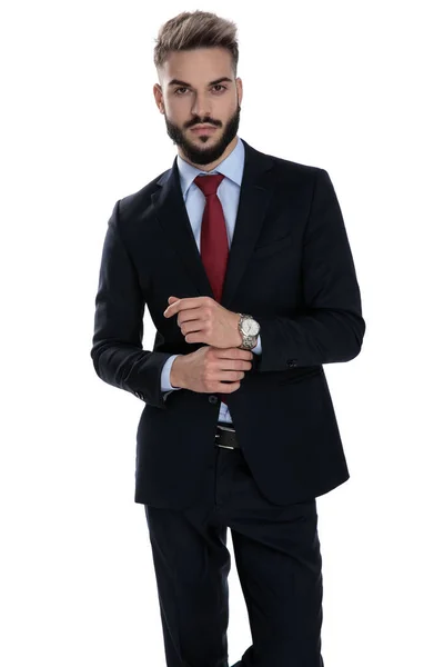 Sexy Young Businessman Arranging Watch Standing Isolated White Background — Stock Photo, Image