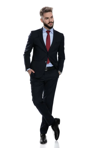 Sexy Young Businessman Holding Hands Pockets Looking Side Standing Isolated — Stock Photo, Image