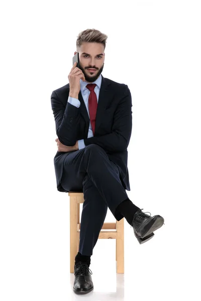 Sexy Young Businessman Talking Phone Sitting Isolated White Background — Stock Photo, Image