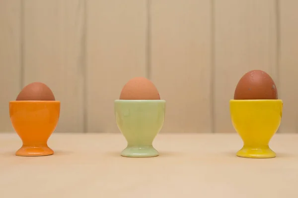 Three Hen Eggs Colored Containers — Stock Photo, Image