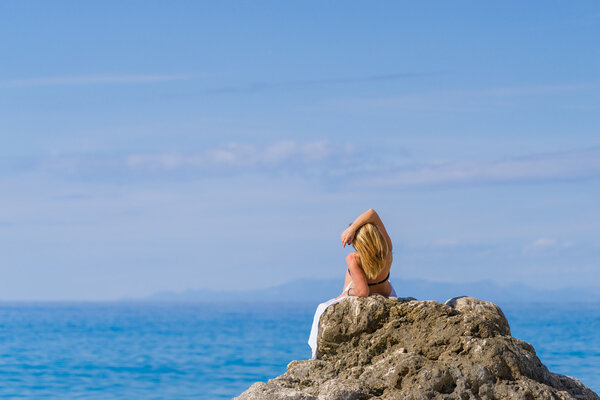 woman relaxing on the beach in Greece