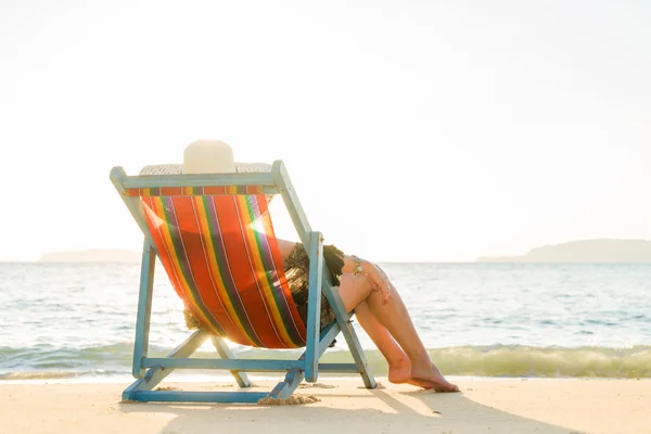 woman relaxing  on sun bed sofa lounge chair on holidays