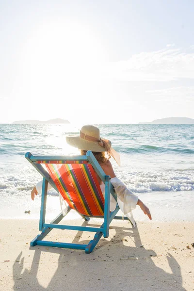 Woman relaxing  on sun bed sofa lounge chair on holidays — Stock Photo, Image