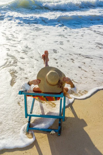 Woman relaxing  on sun bed sofa lounge chair on holidays — Stock Photo, Image