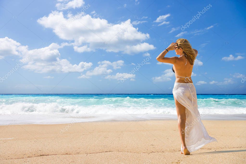 Woman on the wild beach of the island of Lefkada