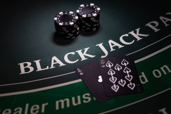 A Casino BlackJack table with black cards