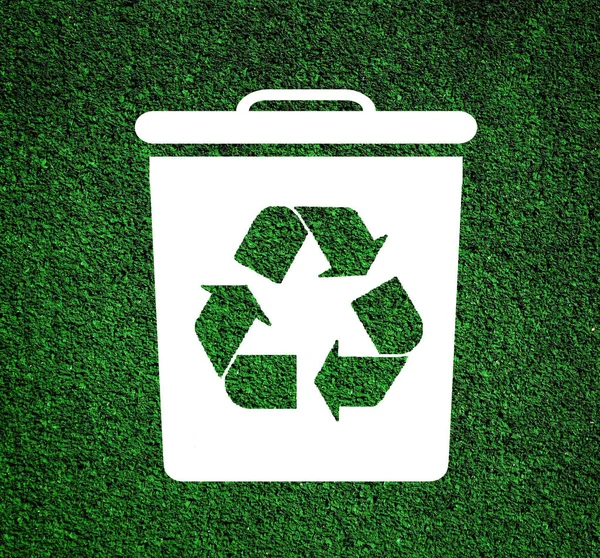 Recycling sign with dustbin on green — Stock Photo, Image