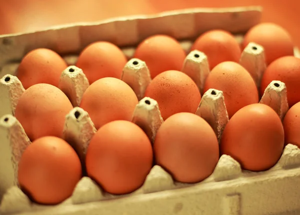 Many of eggs in paper box on table — Stock Photo, Image