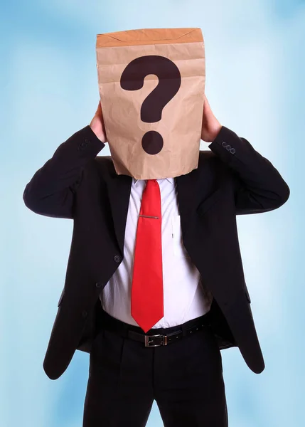 Man with a paper bag on head with question mark — Stock Photo, Image