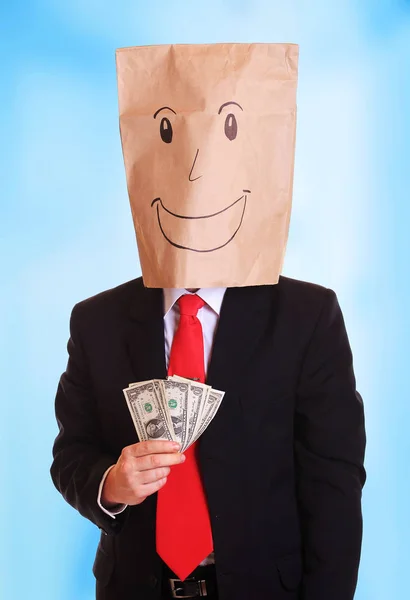 Man bag on head with money notes — Stock Photo, Image