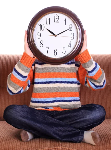 Young child with big clock covering face — Stock Photo, Image
