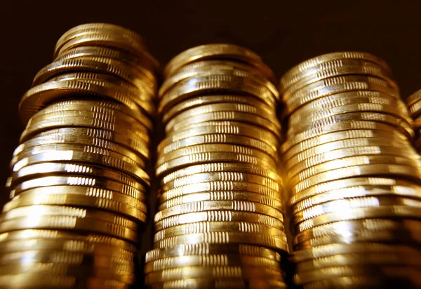 Gold coin piles in tower — Stock Photo, Image