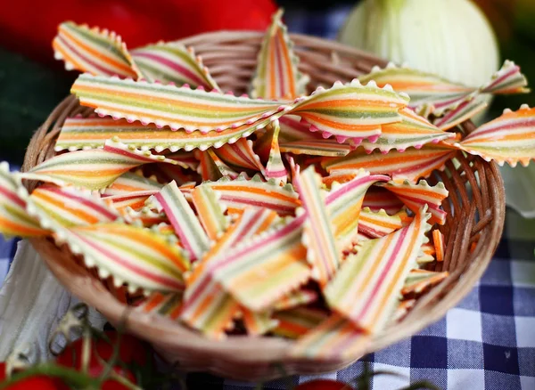 Uncooked stripped colorful italian pasta — Stock Photo, Image