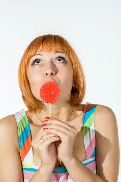 Colorful young woman with lollipop — Stock Photo, Image