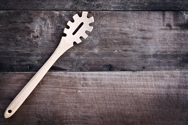 Wooden Spaghetti Fork over Wood Background — Stock Photo, Image