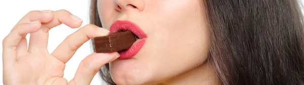 Girl eating chocolate cookie isolated on white background — Stock Photo, Image