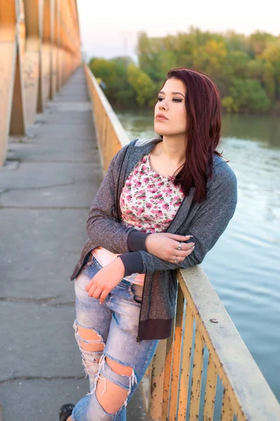 Teenage girl standing on the bridge Royalty Free Stock Photos