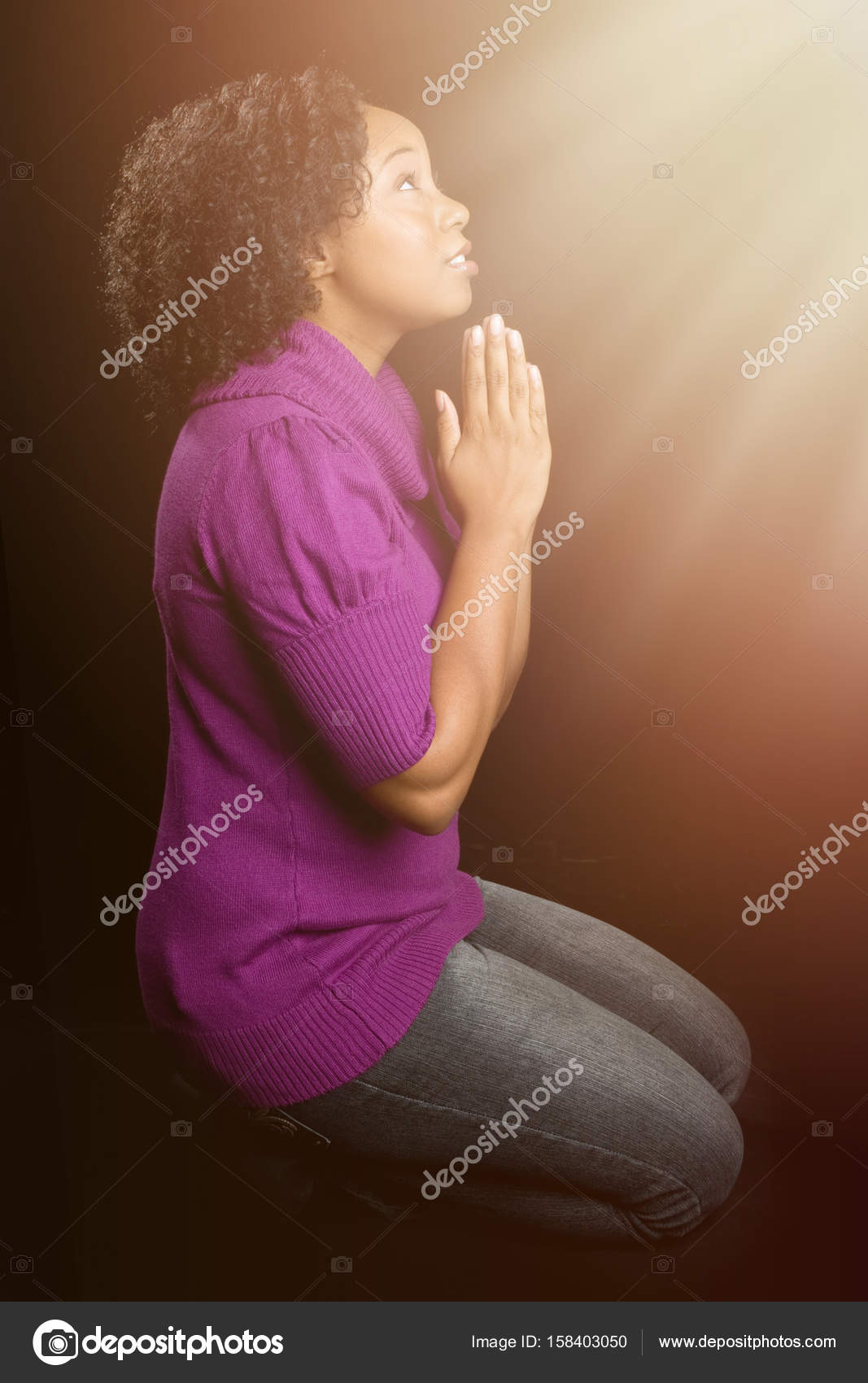 Woman on Knees Praying Stock Photo by ©keeweeboy 158403050