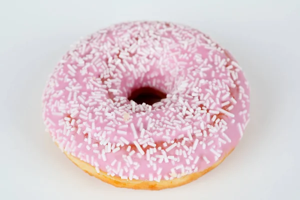 Pink donut with sprinkles — Stock Photo, Image