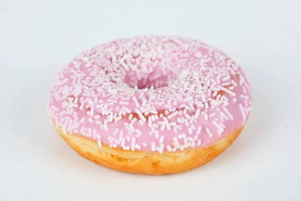 Pink donut with sprinkles — Stock Photo, Image