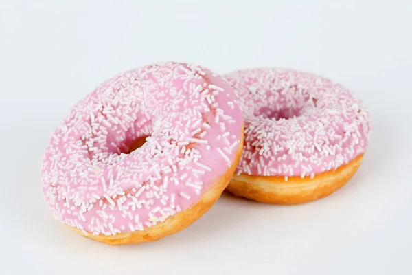 Pink donut with sprinkles — Stock Photo, Image