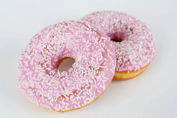 Pink donut with sprinkles — Stock Photo, Image