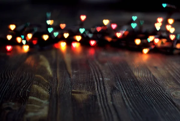 Bokeh καρδιά, ημέρα του Αγίου Βαλεντίνου έννοια σε φόντο ξύλινη — Φωτογραφία Αρχείου