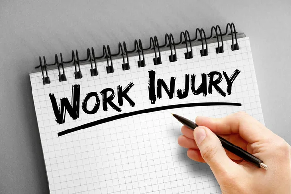 Text note - Work Injury, health concept on notepad