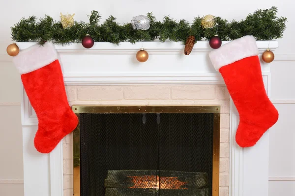 Closeup santa stockings on fireplace — Stock Photo, Image