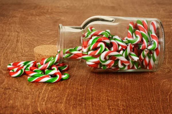 Spilled jar of candy canes — Stock Photo, Image