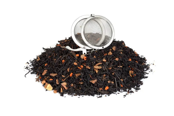 Pile of organic chai tea with pumpkin and infuser ball — Stock Photo, Image