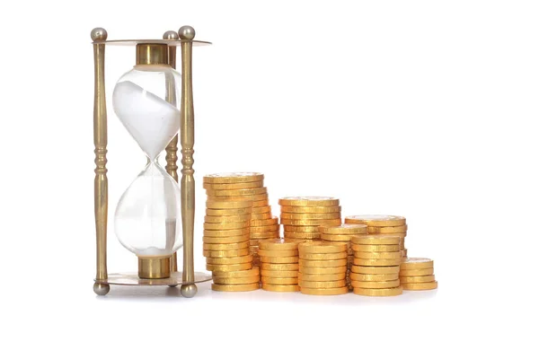 Hourglass and coins time is money concept — Stock Photo, Image