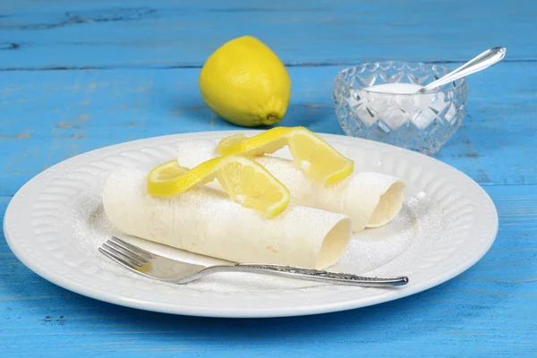 Lemon crepes with icing sugar — Stock Photo, Image