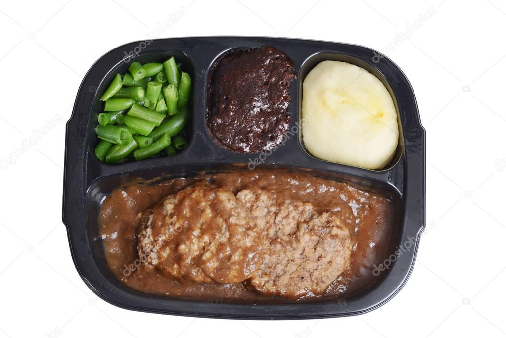 isolated salisbury steak tv dinner with brownie