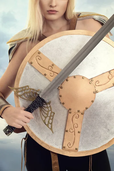 Closeup woman warrior with shield and sword — Stock Photo, Image