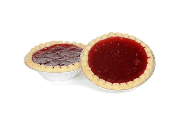 Two strawberry tarts in foil cups — Stock Photo, Image