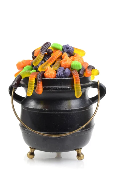 Black cauldron of assorted halloween candy — Stock Photo, Image