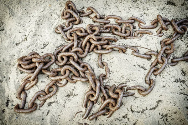 Old chain on sand — Stock Photo, Image