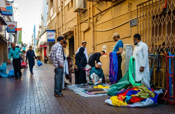 Merchants selling clothes on street in Deira — Stock Photo, Image