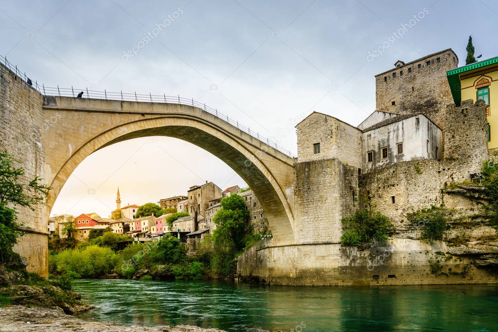 View of famous Mostar Bridge from the bank of Neretva River, Mostar, Bosnia