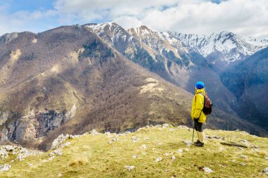 Woman is hiking in Dinaric Alps near Sarajevo, Bosnia-Herzegovina clipart