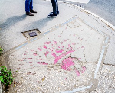 Markings on streets of Sarajevo indicating mortar shells exploded during Bosnian war in 1990s clipart