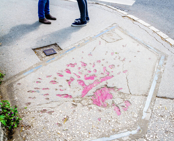 Markings on streets of Sarajevo indicating mortar shells exploded during Bosnian war in 1990s