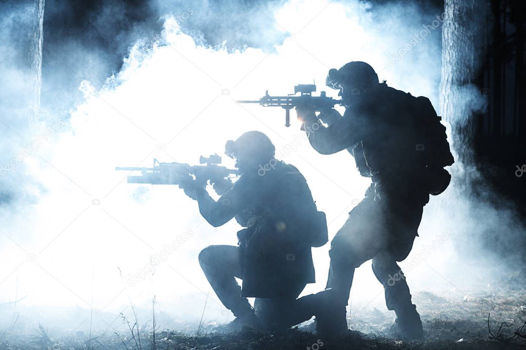 Black silhouettes of soldiers