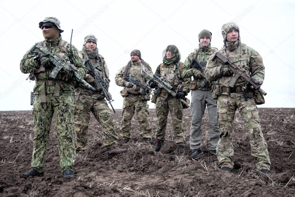Army soldiers group on march in muddy field aaa aaaa aaaa aaa