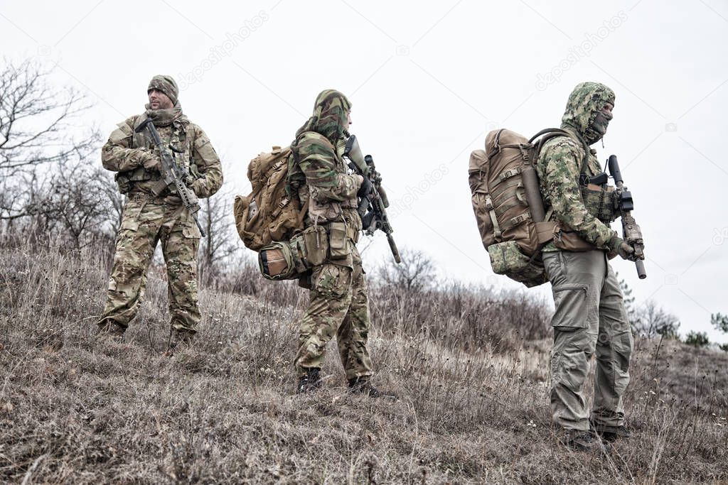 Military army soldiers team members patrolling area