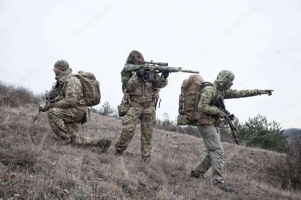 Military army soldiers team members patrolling area