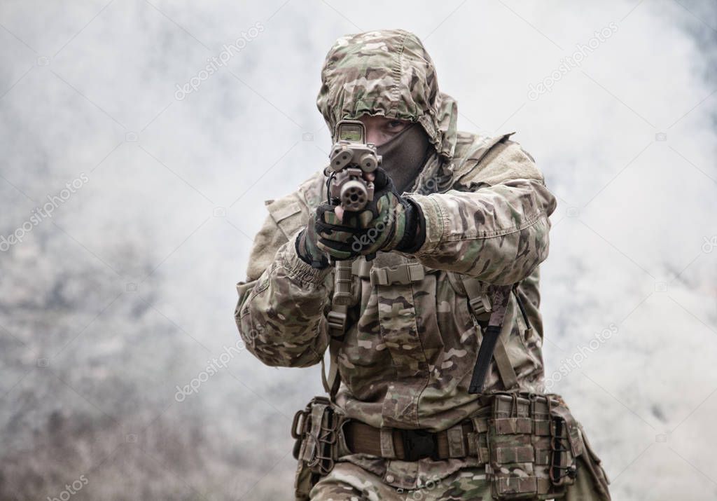 army soldier attacking enemies trough smoke screen